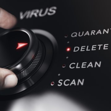 hand on rotating knob dial virus quarantine delete scan antivirus best small business